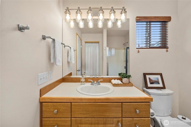 full bathroom featuring vanity, toilet, and an enclosed shower