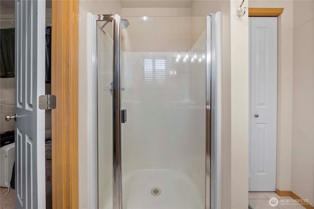 full bathroom with a closet and a shower stall