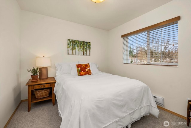 carpeted bedroom featuring baseboards