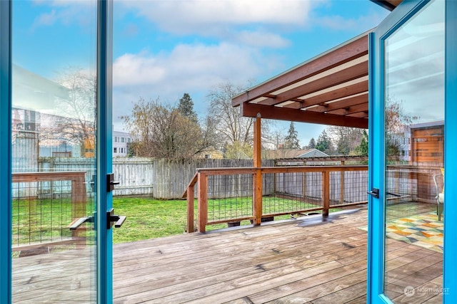 wooden deck with a lawn