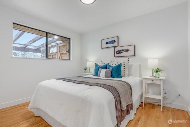 bedroom featuring wood-type flooring