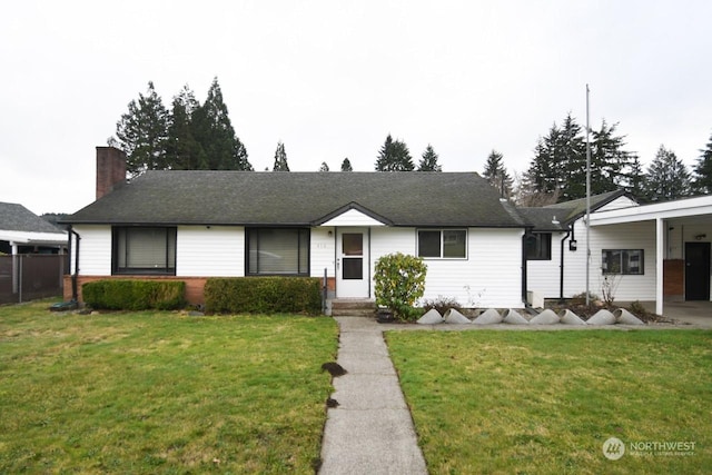 single story home with a front yard and a carport