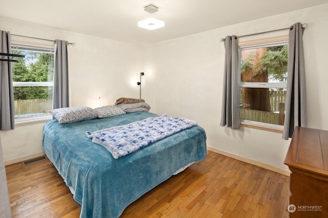 bedroom with wood-type flooring