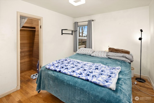 bedroom with hardwood / wood-style flooring