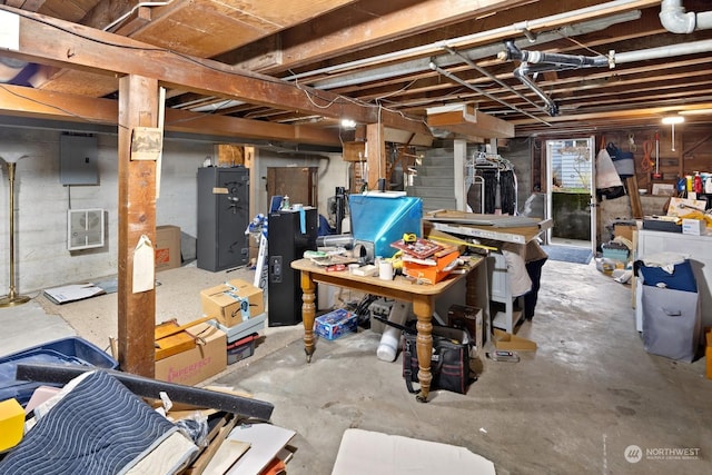 basement featuring electric panel