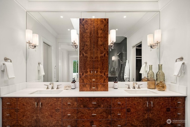 bathroom with vanity and crown molding