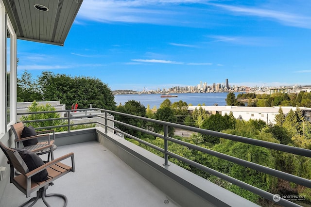 balcony featuring a water view