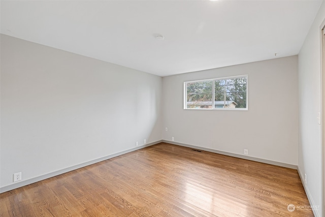 unfurnished room featuring light hardwood / wood-style floors