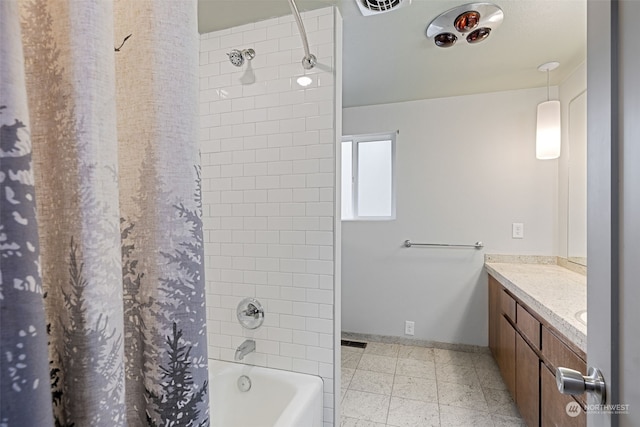 bathroom featuring shower / bath combo and vanity