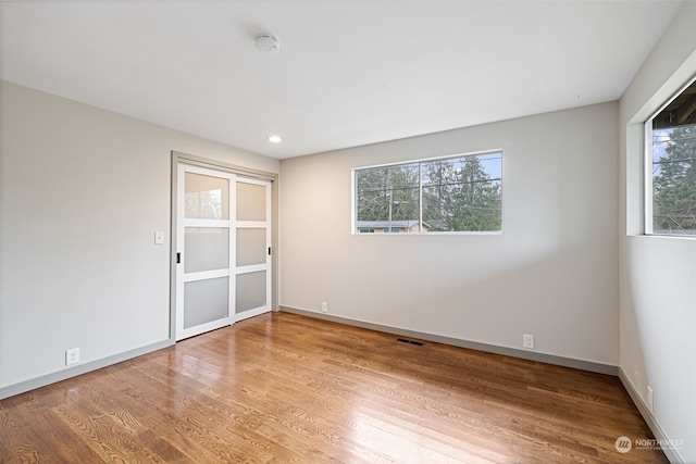 empty room featuring wood-type flooring