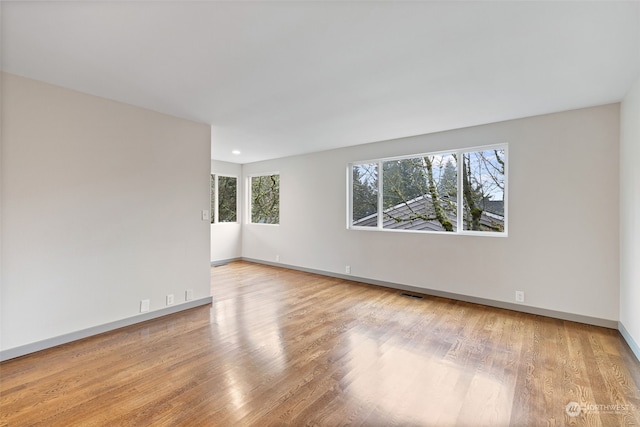 empty room with light wood-type flooring