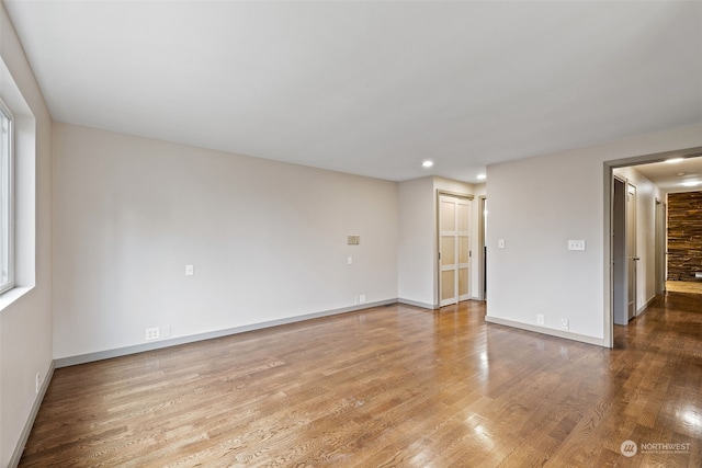 spare room featuring hardwood / wood-style flooring