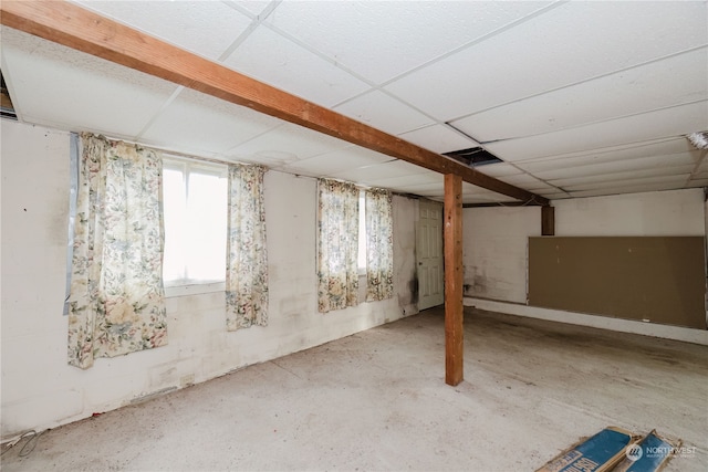 basement featuring a drop ceiling