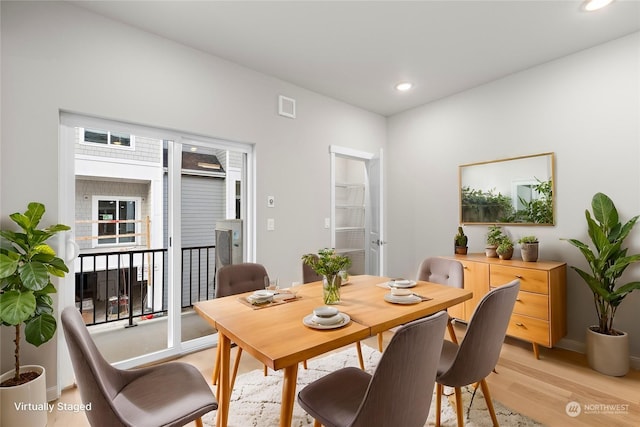 dining room with light wood-type flooring