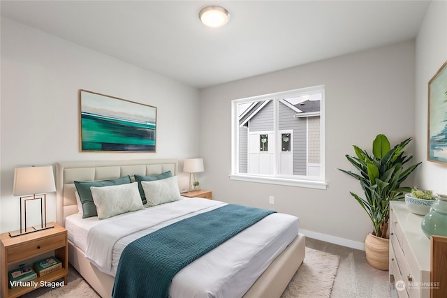 bedroom featuring light carpet