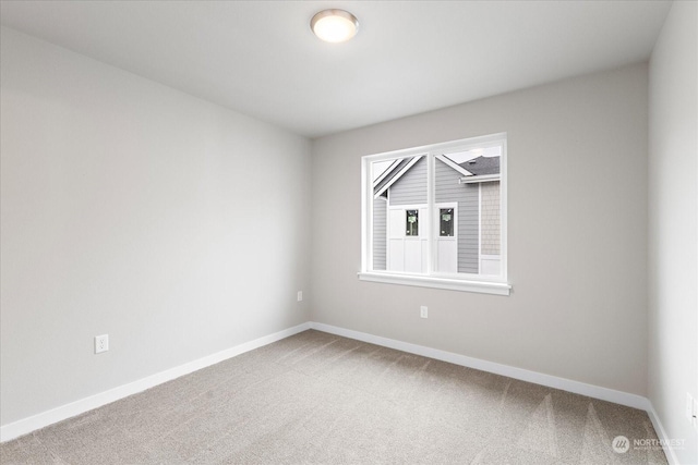 empty room featuring carpet flooring