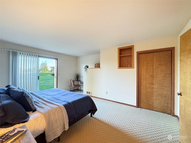 carpeted bedroom featuring a closet