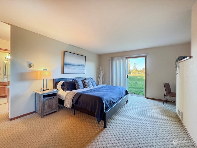 bedroom featuring access to exterior and light carpet