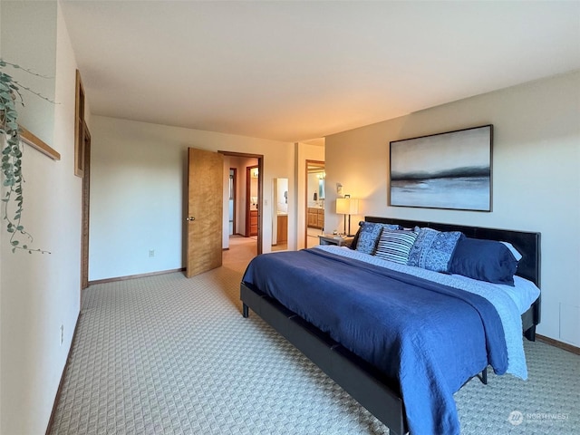 bedroom with carpet flooring and ensuite bath