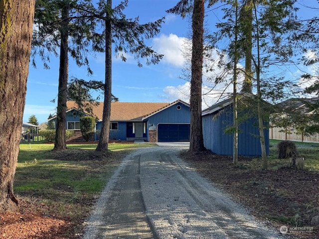 single story home featuring a garage