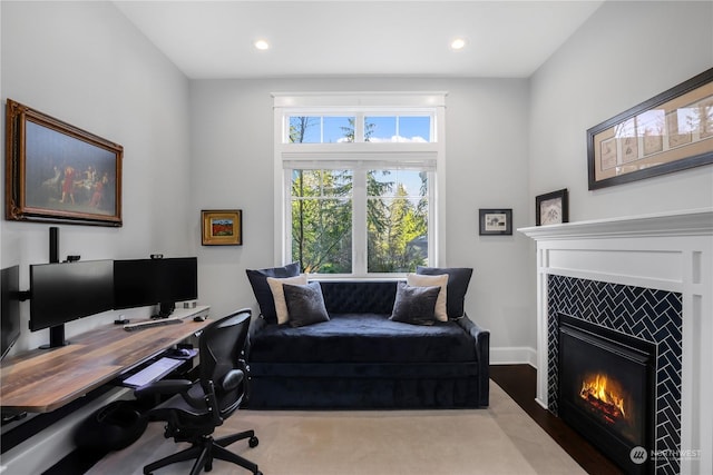 office with a tile fireplace