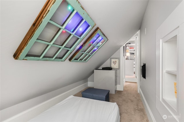 carpeted bedroom featuring lofted ceiling