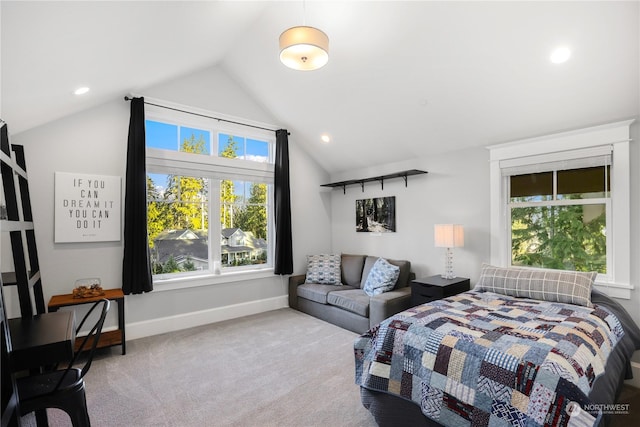 carpeted bedroom featuring lofted ceiling