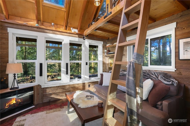 sunroom / solarium with wooden ceiling and lofted ceiling with beams