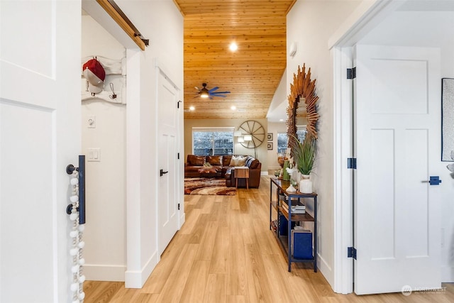 corridor featuring wood ceiling and light hardwood / wood-style floors