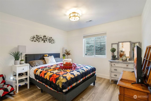 bedroom with light wood-type flooring