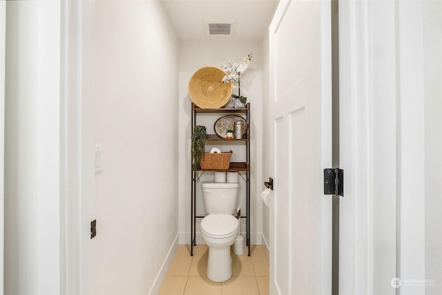 bathroom with tile patterned flooring and toilet