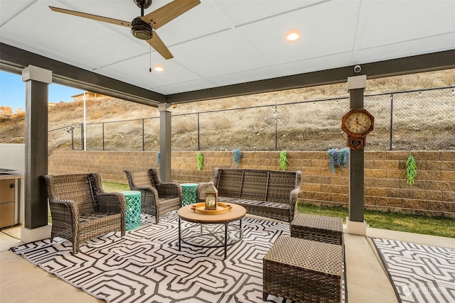 sunroom / solarium featuring ceiling fan and a paneled ceiling