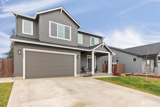 view of front of property with a front lawn and a garage