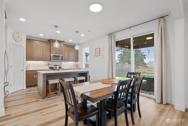 dining room featuring light hardwood / wood-style flooring