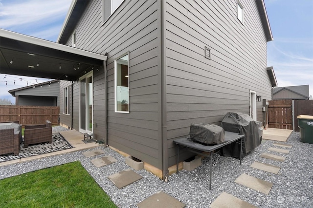 view of side of home featuring a patio area