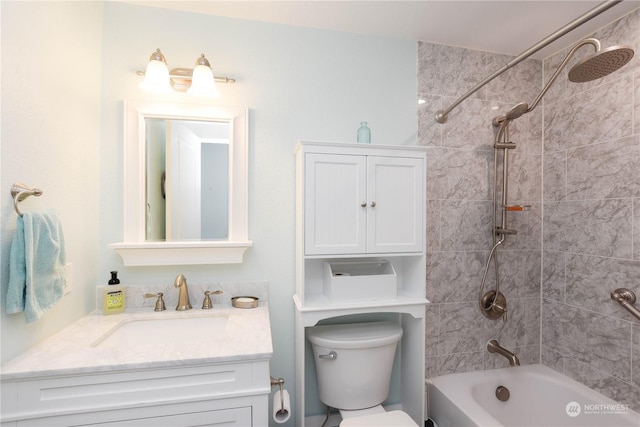 full bathroom featuring toilet, vanity, and tiled shower / bath combo