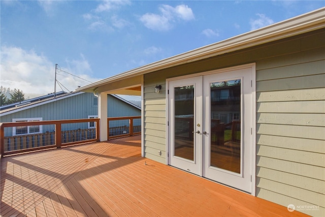 wooden deck featuring french doors