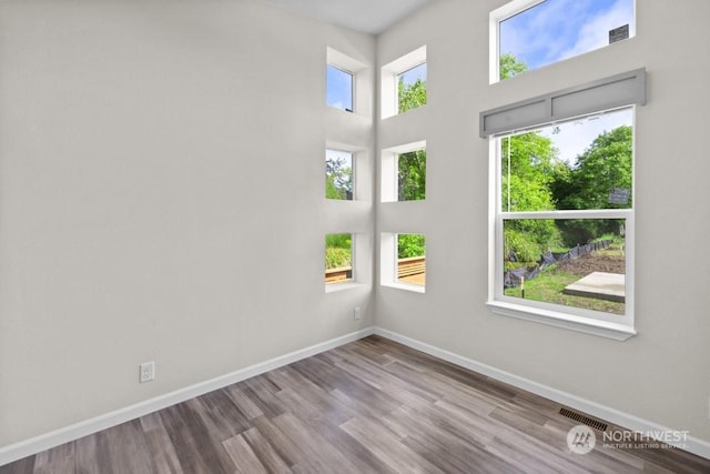 unfurnished room with light hardwood / wood-style flooring