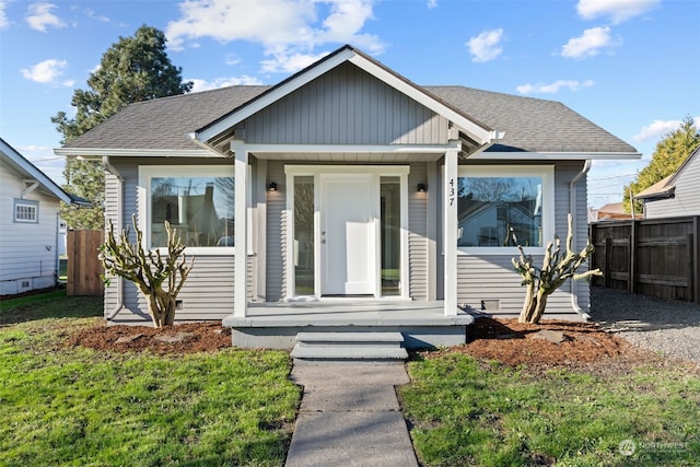 bungalow-style house featuring a front yard