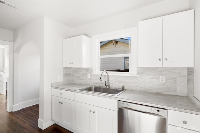 kitchen with white cabinets, stainless steel dishwasher, dark hardwood / wood-style floors, and sink