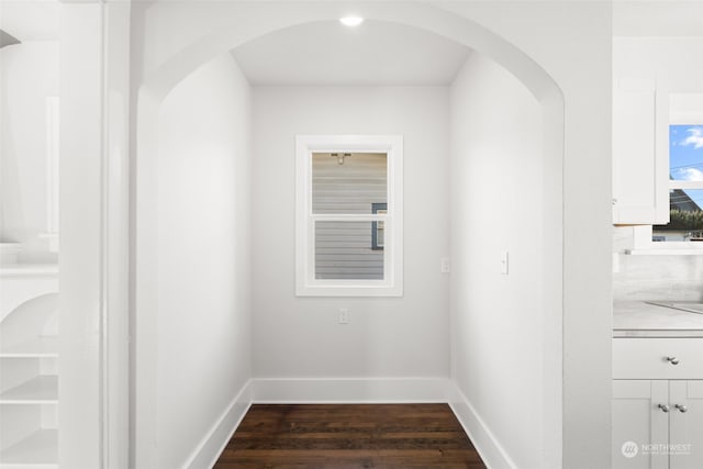 hall with dark hardwood / wood-style flooring