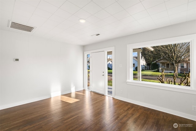 unfurnished room with hardwood / wood-style flooring