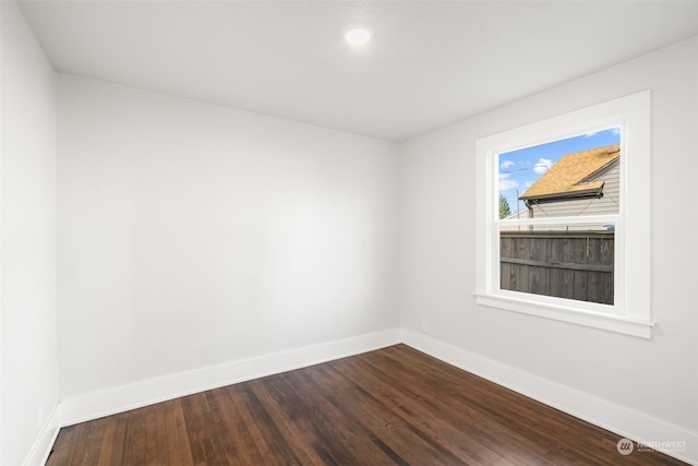 empty room with hardwood / wood-style flooring