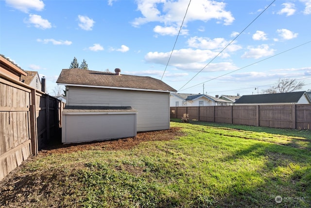 back of house with a lawn