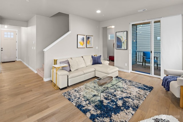 living room with light hardwood / wood-style flooring