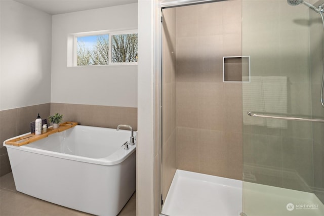 bathroom with tile patterned flooring and plus walk in shower