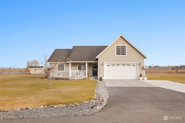 view of front facade featuring a porch, a front yard, and a garage