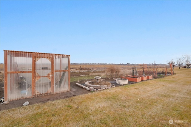 view of yard with a rural view