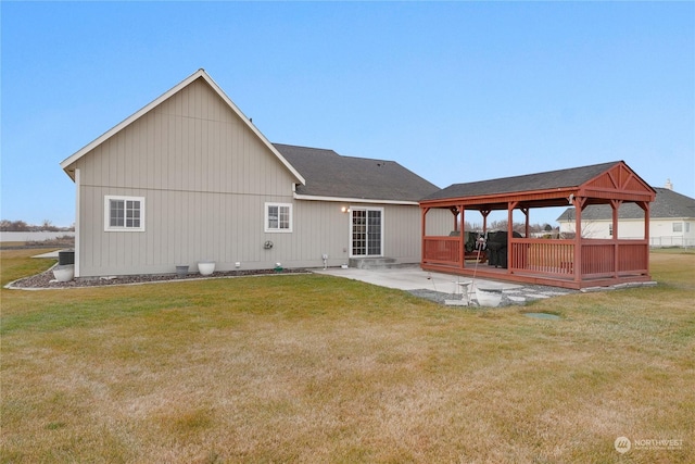 back of house featuring a gazebo, a patio area, a yard, and central AC