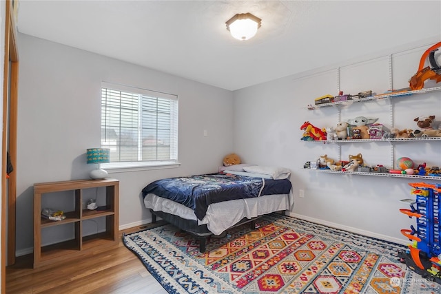 bedroom with light hardwood / wood-style flooring